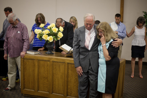 Jim McAuley | The Salt Lake Tribune
Ken Hornok and his wife, Marcia Hornok, pray one last time with their congregation during his last service as pastor after serving for 39 years at Midvalley Bible Church in Bluffdale, Utah, on Sunday, Aug. 25, 2013.