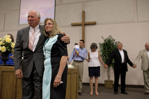 Jim McAuley | The Salt Lake Tribune
Ken Hornok and his wife, Marcia Hornok, pray one last time with their congregation during his last service as pastor for Midvalley Bible Church in Bluffdale, Utah. on Sunday, Aug. 25, 2013.