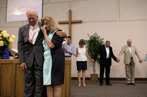 Jim McAuley | The Salt Lake Tribune
Ken Hornok and his wife, Marcia Hornok, pray one last time with their congregation during his last service as pastor at Midvalley Bible Church in Bluffdale, Utah. on Sunday, Aug. 25, 2013.