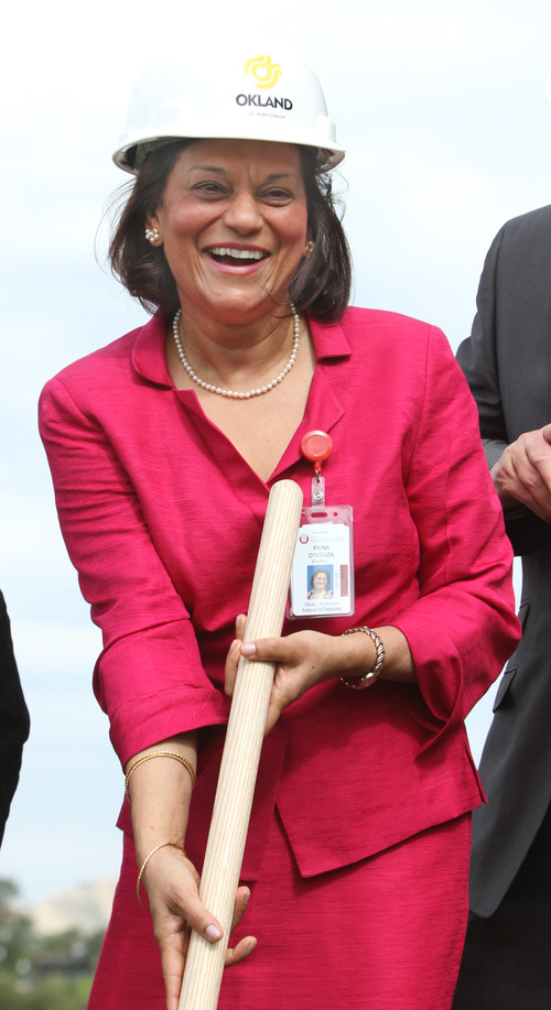 Rick Egan  | The Salt Lake Tribune 

Rena D'Souza, dean of the School of Dentistry at the University of Utah, smiles as she turns over the first shovel of dirt at the groundbreaking for new dental school on Friday.