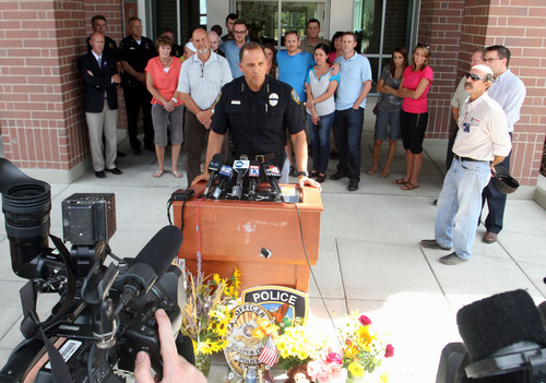 Rick Egan  | The Salt Lake Tribune 

Draper Police Chief Bryan Roberts speaks to the press about the investigation into the murder of Draper Police Sgt. Derek Johnson, at the Draper City Hall, Monday, September 2, 2013. Relatives of Bryan Roberts are in the background.