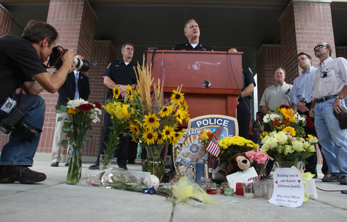 Rick Egan  | The Salt Lake Tribune 

Sheriff Jim Winder speaks to the press about the investigation into the murder of Draper Police Sergeant Derek Johnson, at the Draper City Hall, Monday, September 2, 2013. Relatives of Bryan Roberts are in the background.