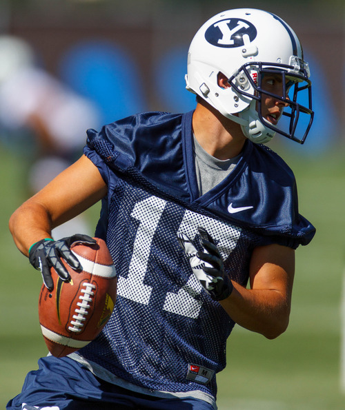 Trent Nelson  |  The Salt Lake Tribune
Skyler Ridley with the ball at BYU football practice in Provo Saturday August 3, 2013.