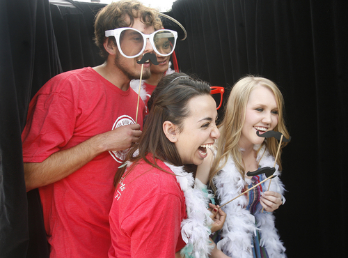 Scott Sommerdorf   |  The Salt Lake Tribune
University of Utah students Jeff De Grauw, left, Luan Truong, upper right, Eileen Bocanegra (hidden), Stef Arevalo, and Laura Madsen pose for photos in a photo booth set up during the University of Utah's College of Fine Arts is holding its 3rd annual Arts Bash on the Library Plaza, Wednesday, September 4, 2013.