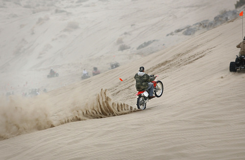 Scott Sommerdorf  |  Salt Lake Tribune
LITTLE SAHARA
A rider powers up "Sand Mountain" at Little Sahara National Recreation Area, Saturday 4/3/10. Four- and two-wheel enthusiasts, dune buggies and more kick off the spring season with motorized recreation and camping at Little Sahara sand dunes., Saturday 4/3/10.