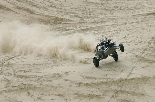Scott Sommerdorf  |  Salt Lake Tribune
LITTLE SAHARA
A "sand rail" nearly gets airborne as it descends "Sand Mountain" at Little Sahara National Recreation Area, Saturday 4/3/10. Four- and two-wheel enthusiasts, dune buggies and more kick off the spring season with motorized recreation and camping at Little Sahara sand dunes., Saturday 4/3/10.