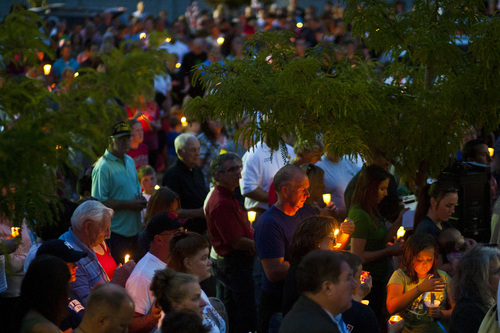 Chris Detrick  |  The Salt Lake Tribune
Family, friends, colleagues and community members participate in a candlelight vigil for Sgt. Derek Johnson at Draper City Hall Sunday September 1, 2013. "This is a very tragic day for the Draper city police department," said Draper Police Chief Bryan Roberts.
