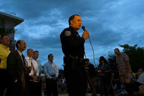 Draper Police Chief Bryan Roberts speaks during a candlelight vigil for Sgt. Derek Johnson at Draper City Hall Sunday Sept. 1, 2013. "This is a very tragic day for the Draper city police department," said Draper Police Chief Bryan Roberts. (AP Photo/The Salt Lake Tribune, Chris Detrick)