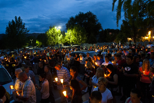 Chris Detrick  |  The Salt Lake Tribune
Family, friends, colleagues and community members participate in a candlelight vigil for Sgt. Derek Johnson at Draper City Hall Sunday September 1, 2013. "This is a very tragic day for the Draper city police department," said Draper Police Chief Bryan Roberts.