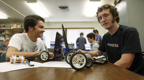Francisco Kjolseth  |  The Salt Lake Tribune
Adam Bean, 16, left, and Tucker Morris, 16, spend time with their robotic creations in their Mechatronics class at the Utah Academy of Sciences. The Utah State Office of Education released the school grades and rankings mandated by the state legislature in which UCAS received an "A" grade earning 642 of 750 points, indicating the highest academic ranking in the state. UCAS is a public early college STEM (Science, Tech, Engineering & Math) charter school located on the UVU campus in Orem.