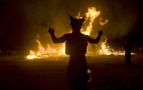 Rick Egan  | The Salt Lake Tribune 

Revelers dance around the flames of The Cradle of "MIR" during the annual Burning Man Festival in the Black Rock Desert, Nev., Friday, August 30, 2013.