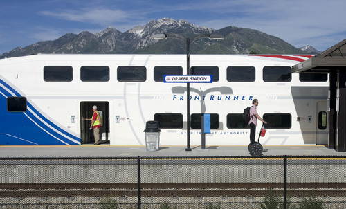 Kim Raff  |  The Salt Lake Tribune
People exit a southbound UTA FrontRunner train at the Draper Station across the street from the new eBay campus in Draper on June 6, 2013.  EBay picked the location of their new campus with it's proximity to the train station in mind. This allows alternate ways for it's employees to travel to work.