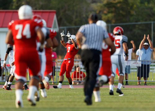Trent Nelson  |  The Salt Lake Tribune
East's Joe Tukuafu celebrates after Preston Curtis caught a touchdown pass on the first play of the game as East High School hosts Kahuku (HI), high school football Saturday, August 31, 2013 in Salt Lake City.