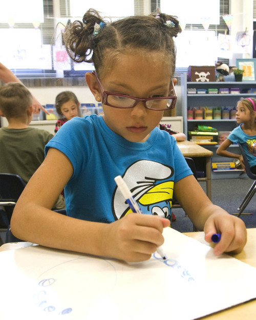 Rick Egan  | The Salt Lake Tribune 

Thalia Green-Esquibel works on her assignment, at Polk Elementry School, Wednesday, September 4, 2013. Lawmakers who support Utah's new system for giving letter grades to schools point to Polk Elementary, which received a 'B' grade, as a success story.