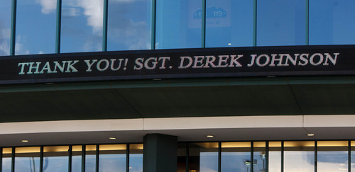 Trent Nelson  |  The Salt Lake Tribune
Signs display, "Thank You! Sgt. Derek Johnson" at the Maverik Center in West Valley City Thursday, September 5, 2013 for the viewing for Sgt. Derek Johnson, the Draper police officer who was shot to death on Sunday morning.