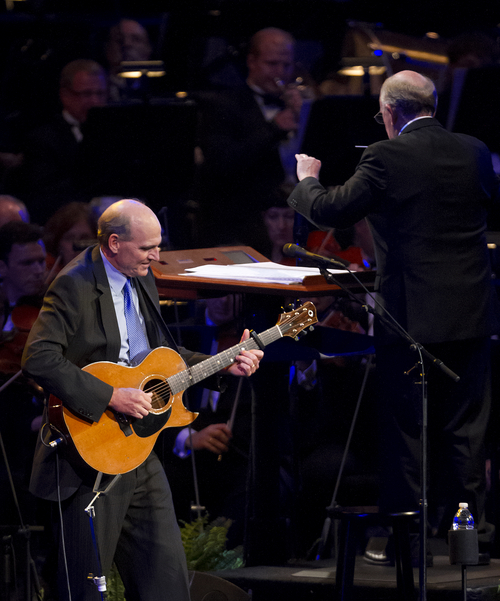 Michael Mangum  |  Special to the Tribune

James Taylor performs as Mack Wilberg conducts at the O.C. Tanner Gift of Music Gala Concert featuring the Utah Symphony and the Mormon Tabernacle Choir at the LDS Conference Center on Friday, September 6, 2013.
