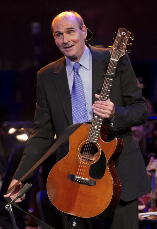 Michael Mangum  |  Special to the Tribune

James Taylor takes the stage at the beginning of the O.C. Tanner Gift of Music Gala Concert featuring the Utah Symphony and the Mormon Tabernacle Choir at the LDS Conference Center on Friday, September 6, 2013.