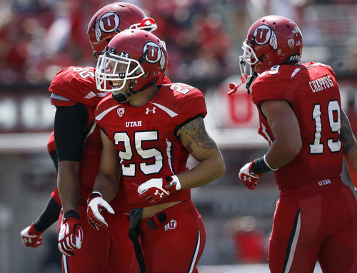 Scott Sommerdorf   |  The Salt Lake Tribune
Utah Utes defensive back Mike Honeycutt (25) smiles after his 21 yard fumble recover for a TD on a kickoff play to make the score 42-0. Utah cruised to a 49-0 halftime lead over Weber State, Saturday, September 7, 2013.