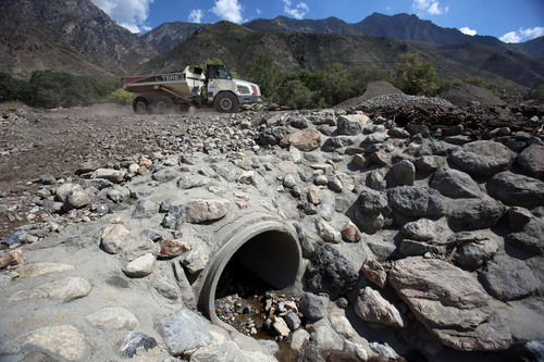Francisco Kjolseth  |  The Salt Lake Tribune
Drainage pipes were completely overtaken as crews work to remove large amounts of debris caused by heavy rains along the benches above Alpine that were severely compromised following last years fires. Several drainages flowed freely with mud, ash and rock completely overflowing catch basins and flooding homes.
