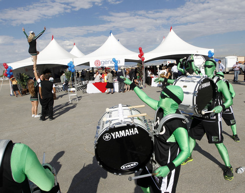 Al Hartmann  |  The Salt Lake Tribune
The Green Men drum group and cheerleaders from Utah Valley University greet visitors for the announcment of @Geneva, a large master-planned community on the site of the old Geneva steel mill in Utah Countyon  Friday Sept. 6. Matthew Holland, president of UVU, didn't deny rumors that the fast-growing university might build a football stadium. (He didn't confirm them either.)