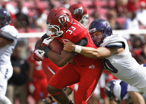 Scott Sommerdorf   |  The Salt Lake Tribune
Utah Utes RB Marcus Williams (33) rushes the ball to the Weber State one yard line to set up Utah's final points. Making the TD saving tackle is Weber State Wildcats LB Roman Valenzuela (50). Utah crushed Weber State 70-7, Saturday, September 7, 2013.