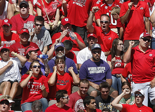 Scott Sommerdorf   |  The Salt Lake Tribune
Quiet and disappointed Weber State fans watch as the score mounts inside a sea of red Ute fans. Utah cruised to a 49-0 halftime lead over Weber State, Saturday, September 7, 2013.