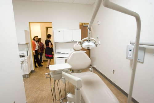 Paul Fraughton  |   Salt Lake Tribune
 Visitors touring  the new Community Learning Center in the Glendale neighborhood of Salt Lake City look in on a dental  care room at the center. The  center will provide educational opportunities for adults and children, as well as providing a medical clinic with dental and vision care available.                          
 Tuesday, September 10, 2013