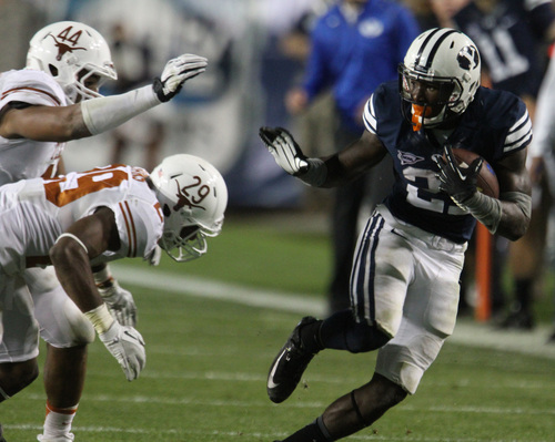 Rick Egan  | The Salt Lake Tribune 

 Brigham Young Cougars running back Jamaal Williams (21) gets past Texas Longhorns defensive back Sam Moeller (44) and Texas Longhorns defensive back Deshazor Everett (29) as BYU played the University of Texas, Lavell Edwards stadium, Saturday, September 7, 2013.