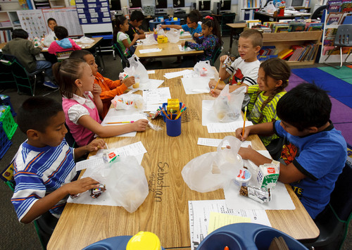 Trent Nelson  |  The Salt Lake Tribune
Students eat breakfast at their desks at Odyssey Elementary School in Ogden Tuesday, September 3, 2013 in Ogden. At three Ogden schools, students have a new breakfast option: milk, juice, fruit and whole-grain items, and a designated breakfast period to start the day.