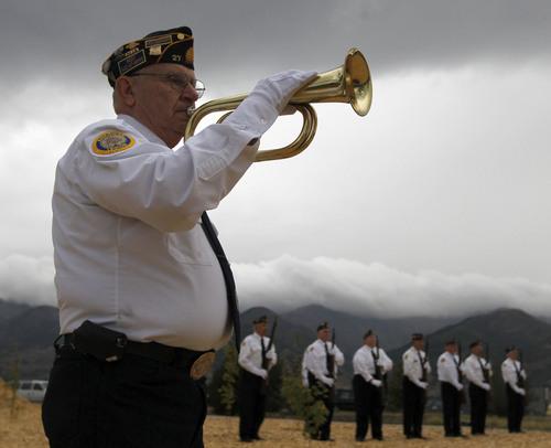 Al Hartmann  |  The Salt Lake Tribune
Frank Lennartz with Farmington American Legion Post 27 plays taps during  at an early-morning 9/11 ceremony at the Utah State University Botanical Center in Kaysville Wednesday morning.