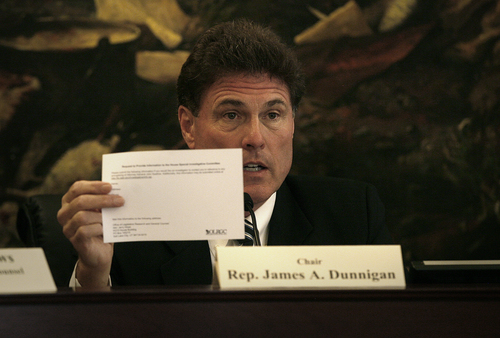 Scott Sommerdorf   |  The Salt Lake Tribune
Chairman of the House Special Investigative Committee, Rep. James Dunnigan holds up the information the public may follow to get in touch with the investigative team looking into allegations of misconduct by Atty. Gen. John Swallow. It was the first public appearance of the special counsel Steven Reich and lead investigator James Mintz, Wednesday, September 11, 2013.