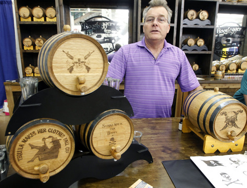 Al Hartmann  |  The Salt Lake Tribune
Curt DeArmond from Nampa Idaho sells White Oak hand crafted barrels to store spirits, vinegars, hot sauces and root beers at the Utah State Fair Thursday September 12.   He says that interest has been high and business sales good for the barrels.