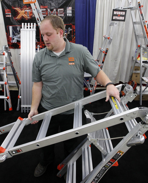 Al Hartmann  |  The Salt Lake Tribune
Peton Nielsen demonstrates an articulating "Little Giant" ladder  in the vendors building at the Utah State Fair on Thursday. The adjustable ladders are made in Springville.
