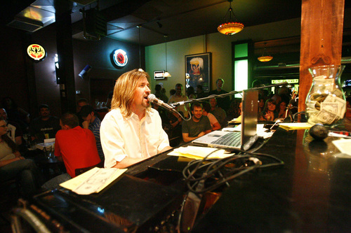 Pianist Eric Mangum performs as the audience sings at the Tavernacle.
The Tavernacle is a social club featuring drink, piano accompanied singing and crowd participation located in Salt Lake City, UT.
Photo by Danny Chan La/The Salt Lake Tribune 8-4-2007