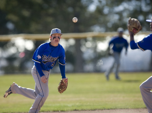 Kim Raff  |  The Salt Lake Tribune
Pleasant Grove infielder Easton Walker tosses the ball to second after picking up a ground ball during a game against Alta at Pleasant Grove High School on March 21, 2013.