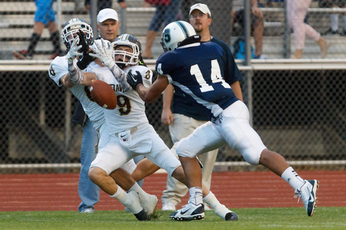 Trent Nelson  |  The Salt Lake Tribune
Davis's Conner Simonsen (6) and Jaden Richins (9) reach for a pass that was ruled incomplete as Syracuse hosts Davis High School football Thursday, September 12, 2013 in Syracuse.