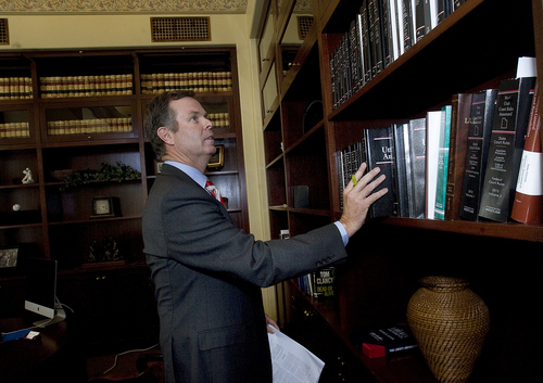 Scott Sommerdorf   |  The Salt Lake Tribune
Utah Attorney General John Swallow chooses from a group of law books in his office on the day it was announced the U.S. Department of Justice will not prosecute him, Thursday, September 12, 2013.