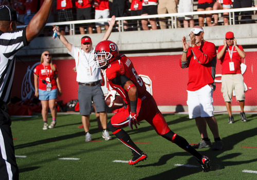 Trent Nelson  |  The Salt Lake Tribune
Utah Utes wide receiver Dres Anderson (6) pulls in a first quarter touchdown pass from quarterback Travis Wilson (7) as the University of Utah hosts Utah State, college football Thursday, August 29, 2013 at Rice-Eccles Stadium in Salt Lake City.