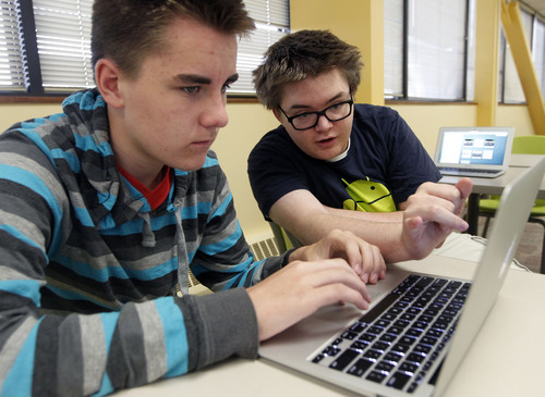 Al Hartmann  |  The Salt Lake Tribune
Tevis Hadley, left, sets up his email account with some help from Arthur Tucker at Kaysville charter school Career Path High. All 175 students were awarded an Apple laptop for the school year under the Smart Schools program.