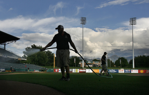 Scott Sommerdorf   |  The Salt Lake Tribune
Members of teh Bees groundscrew prepare the field at Spring Mobile Ballpark prior to game 4 of the PCL Championship Series against the Omaha Storm Chasers, Saturday, September 14, 2013.