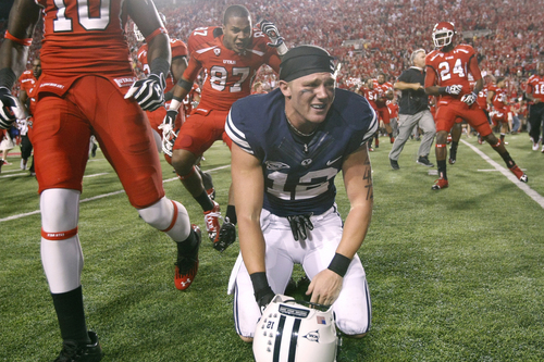 Chris Detrick  |  The Salt Lake Tribune
Brigham Young Cougars wide receiver JD Falslev (12) collapses on the field after missing the potential game winning field goal after the game at Rice-Eccles Stadium Saturday September 15, 2012.  Utah won the game 24-21.