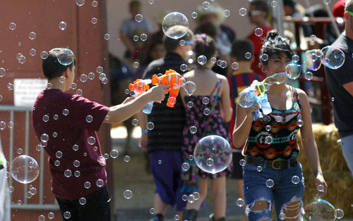 Al Hartmann  |  The Salt Lake Tribune
People demonstate bubble making toys Sunday afternoon on the final day of the Utah State Fair.