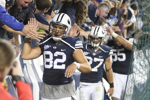 Rick Egan  | The Salt Lake Tribune 

Brigham Young Cougars tight end Kaneakua Friel (82) leads a group of players as the fans congratulate them, in  the Cougars 40-21 win over the University of Texas at Lavell Edwards stadium, Saturday, September 7, 2013.