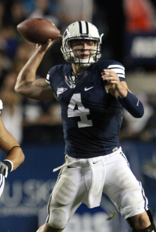 Rick Egan  | The Salt Lake Tribune 

Brigham Young Cougars quarterback Taysom Hill (4) throws for the cougars, in their 40-21 win over the University of Texas at Lavell Edwards stadium, Saturday, September 7, 2013.