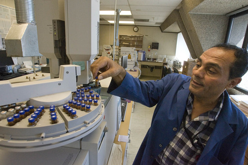 Paul Fraughton  |   The Salt Lake Tribune
Mohammed Sharaf loads a sample into a mass spectrometer to test for pesticide residues. The Pesticide Residue Lab is one of several labs taking up the third floor of the Utah State  Agriculture Building on Redwood Road.     Wednesday, August 28, 2013