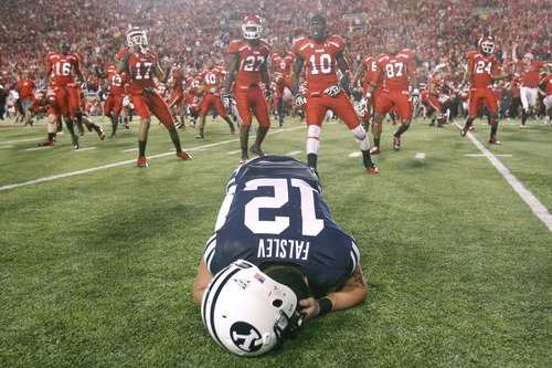 Chris Detrick  |  The Salt Lake Tribune
Brigham Young Cougars wide receiver JD Falslev (12) collapses on the field after a potential game-tying field goal is missed at Rice-Eccles Stadium on Saturday, Sept. 15, 2012.  Utah won the game 24-21.