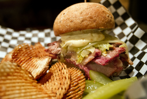 Keith Johnson | The Salt Lake Tribune

"The 36," comprised of house-made pastrami, saurkraut and rye bun and melted gruyere, is one of The Rest's signature dishes. The New York City -inspired speakeasy is located beneath The Bodega in Salt Lake City.