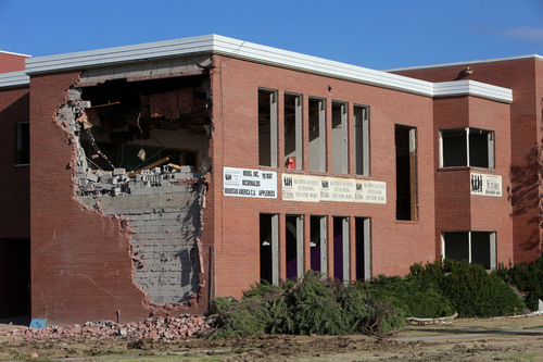 Francisco Kjolseth  |  The Salt Lake Tribune
The old Granger High school in West Valley City begins to come down as crews start the demolition process on Wednesday, Sept. 18, 2013.