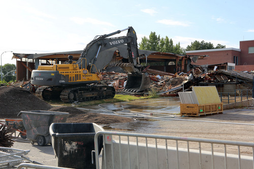 Francisco Kjolseth  |  The Salt Lake Tribune
Half of the old Granger High school cafeteria, known by the students as Stonehenge in West Valley City, begins to come down as crews start the demolition process on Wednesday, Sept. 18, 2013.