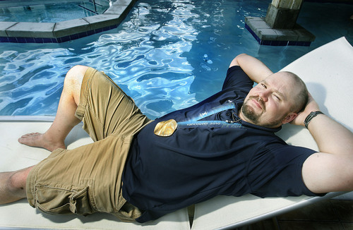 Scott Sommerdorf  l  The Salt Lake Tribune

Park City's Steve Holcomb relaxes on a chaise lounge poolside at the Newpark Resort, Saturday, 7/31/10. Holcomb broke a 62-year drought when he won the Olympic gold medal in the four-man bobsled at the Vancouver Games, and since then he has been carting the thing to every corner of the world. He has traveled nearly 60,000 miles since his victory, and returned to Utah for all of 24 hours, Saturday, 7/31/10.